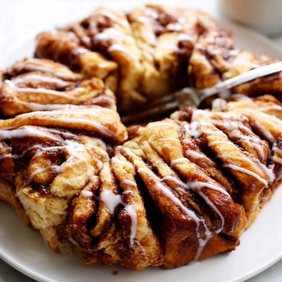Warm Cinnamon Sugar Pull-Apart Bread rising in a loaf pan, golden and inviting, perfect for dessert.  