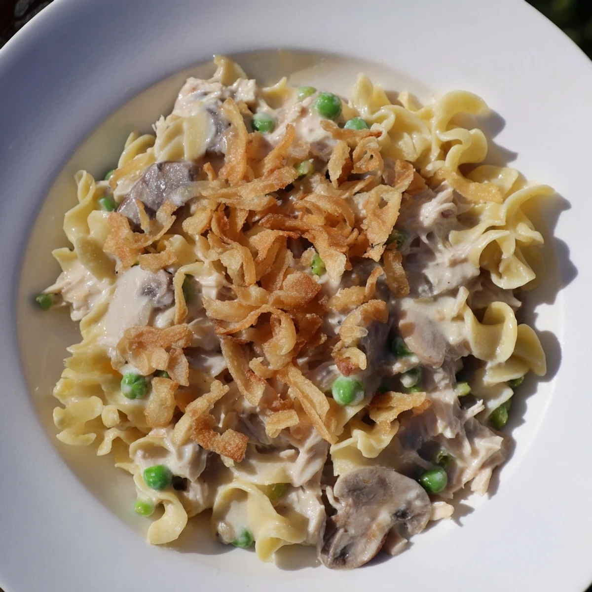 Golden-crusted Homemade Tuna Noodle Casserole, bubbly and cheesy, ready to be served hot.