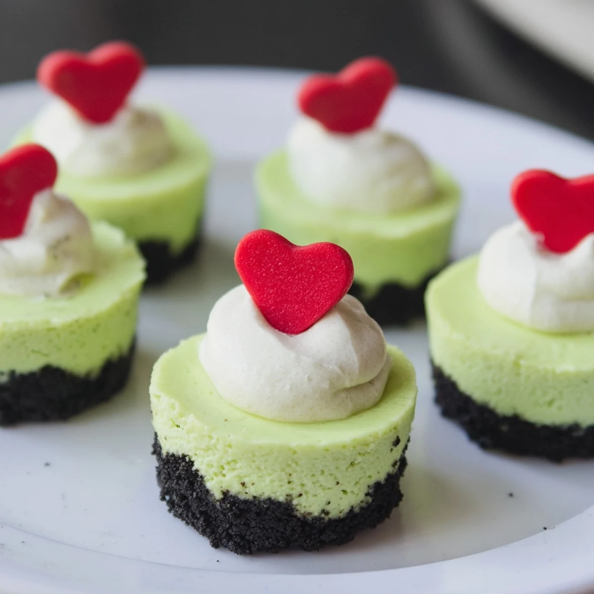 These adorable Grinch Mini Cheesecakes are a fun, easy dessert that everyone can enjoy at your party!