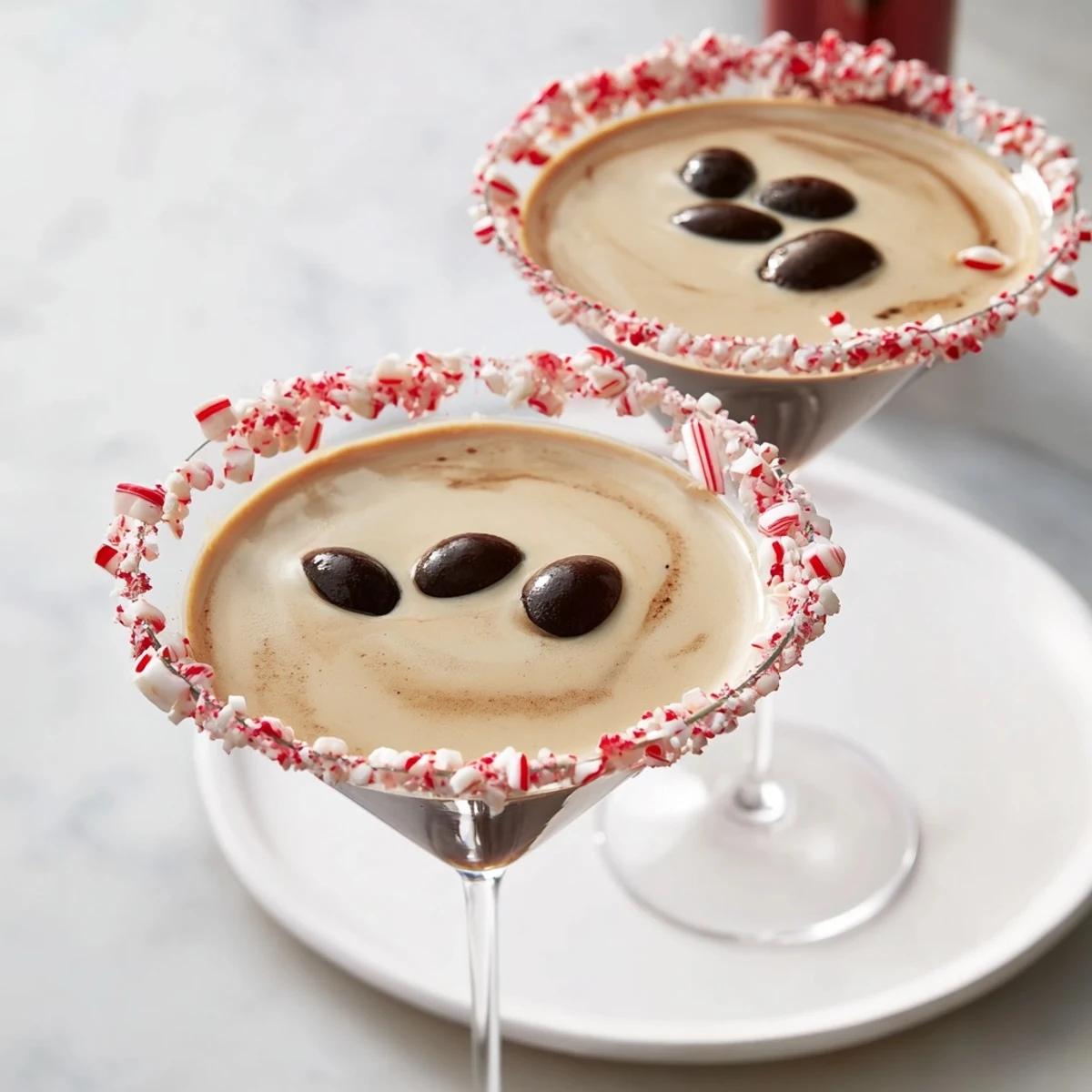 Dark and creamy, these Peppermint Espresso Martinis are garnished with rich coffee beans.