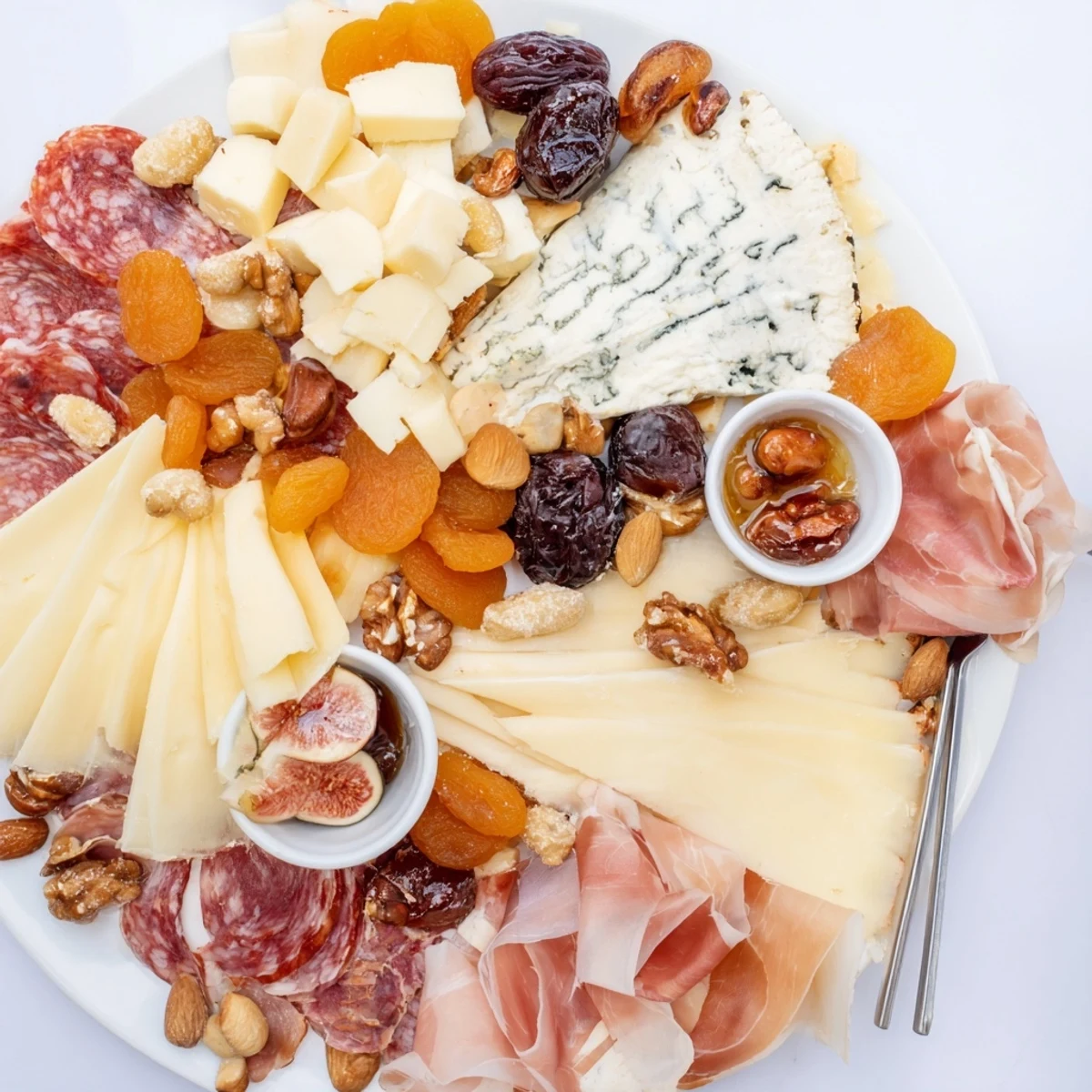 A beautiful, colorful display of Plateau des Rois Mages Gourmand, offering sweet and savory treat pairings.