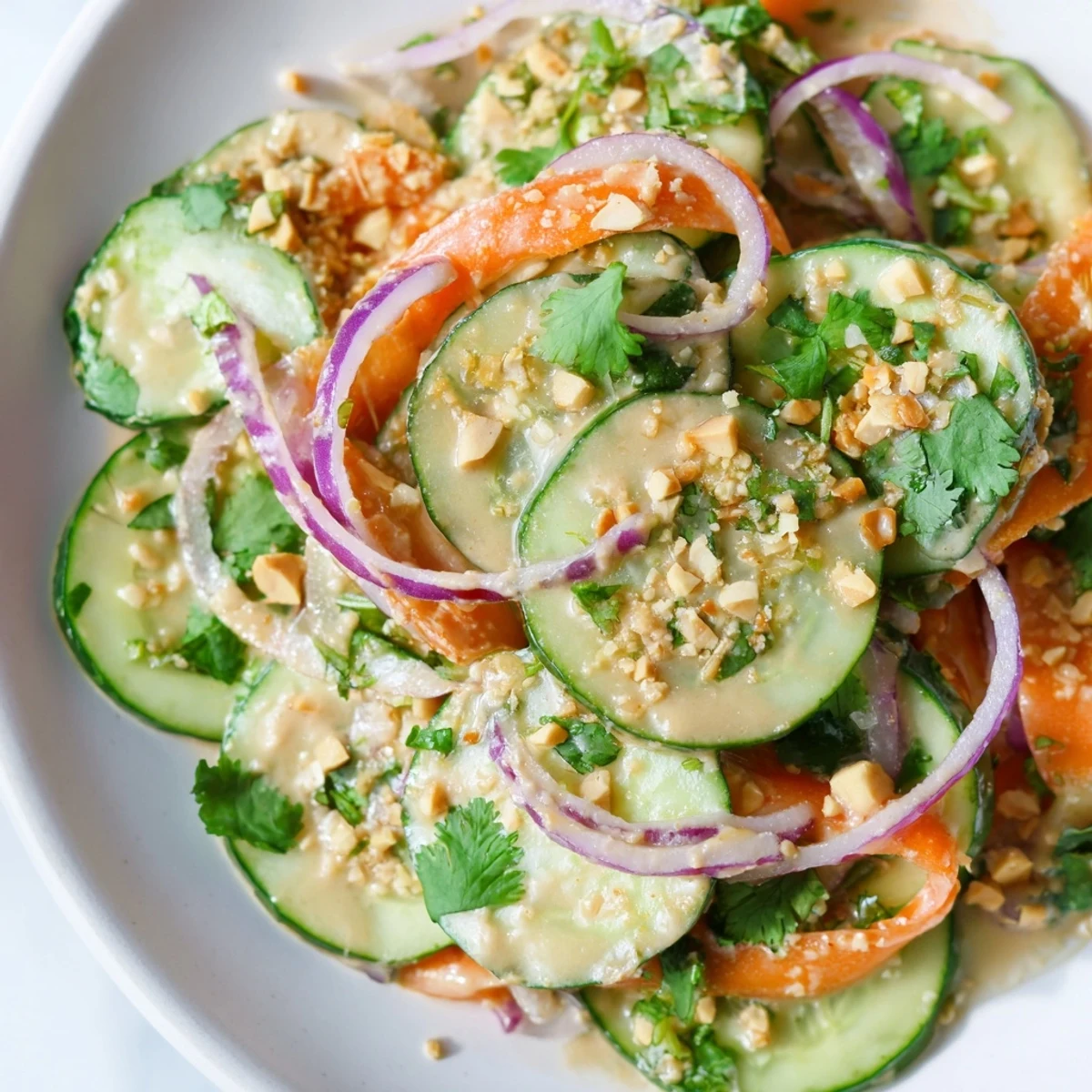 Fresh, vibrant Thai-Style Peanut Cucumber Salad with bright vegetables and creamy dressing, ready to enjoy.
