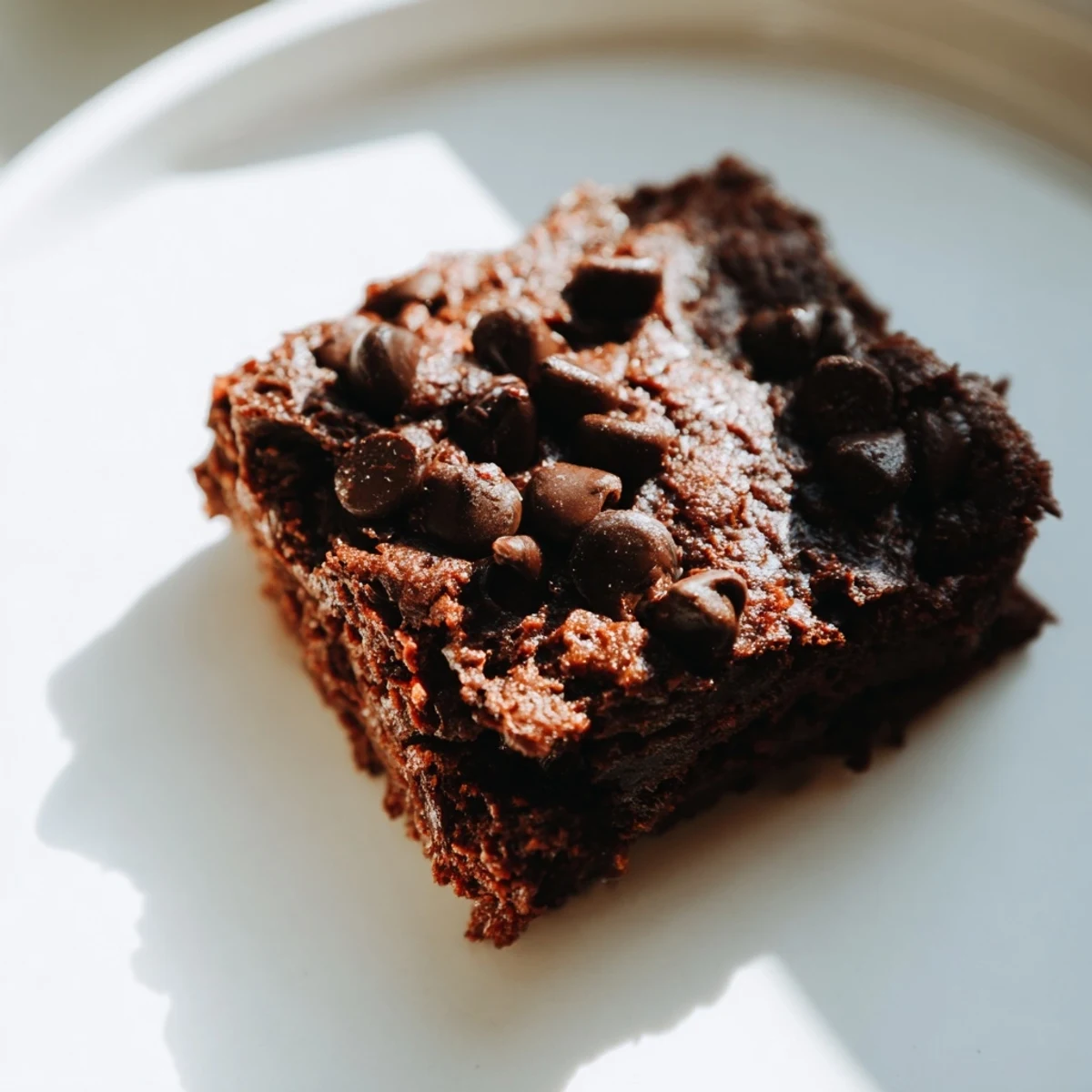 Freshly baked and decadent Greek Yogurt Brownies, a delicious guilt-free dessert, perfect with a glass of milk.