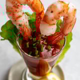 Delicious Retro Prawn Cocktail Shooters, featuring a vibrant mixture of shrimp and flavorful homemade cocktail sauce.
