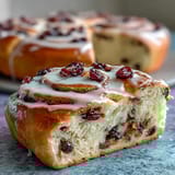 Soft sourdough bread loaf filled with tangy lemon and sweet blueberry swirl, ideal for a fresh homemade treat.  