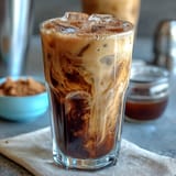 Iced Brown Sugar Oat Milk Shaken Espresso, perfectly blended with creamy dairy-free goodness.