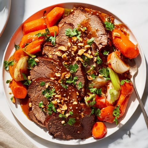 Succulent slow cooker honey garlic pork roast served over tender vegetables.  