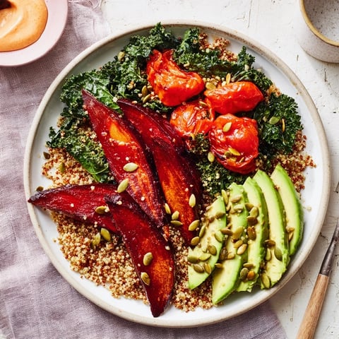 A colorful Quinoa, Kale & Roasted Beet Bowl with creamy tahini dressing, showcasing healthy ingredients.