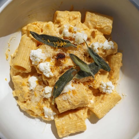 Golden roasted butternut squash and sage with creamy goat cheese pasta, ready to serve.