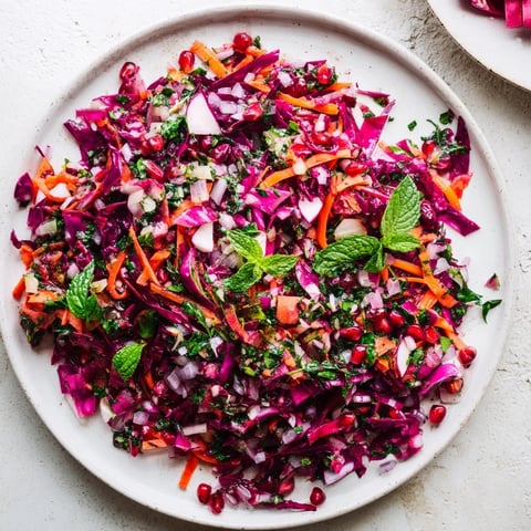 Vibrant Shirazi-Inspired Winter Slaw, a colorful salad with crunchy vegetables and citrus dressing.