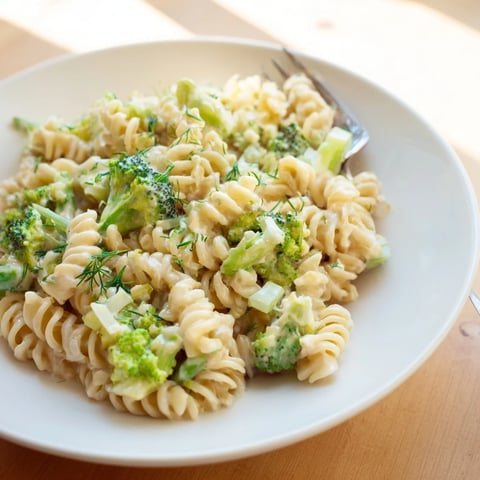 Creamy Green Goddess Broccoli Cheddar One-Pot Pasta with vibrant broccoli and melted cheddar.