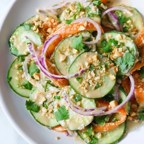 Fresh, vibrant Thai-Style Peanut Cucumber Salad with bright vegetables and creamy dressing, ready to enjoy.