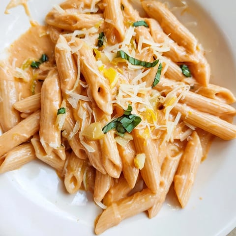 Creamy Basil Garlic One-Pot Tomato Pasta, bubbling and served, garnished fresh basil leaves, ready to be enjoyed.