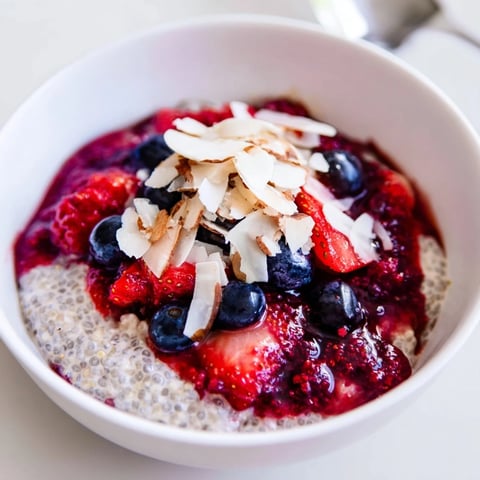 Creamy berry chia pudding layered with vibrant mixed berries, a delicious, make-ahead breakfast treat.