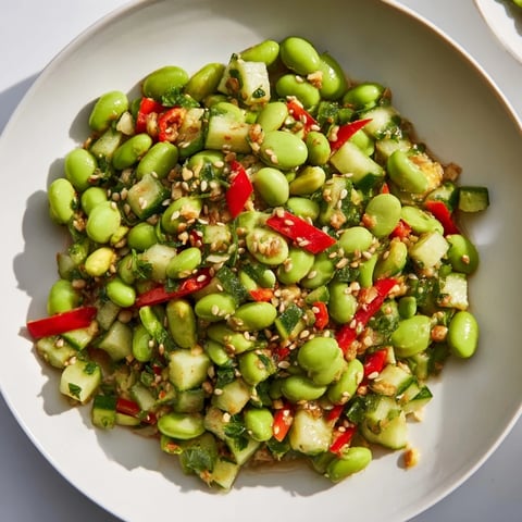 Vibrant edamame salad with crisp cucumber and savory sesame dressing, ready to enjoy.