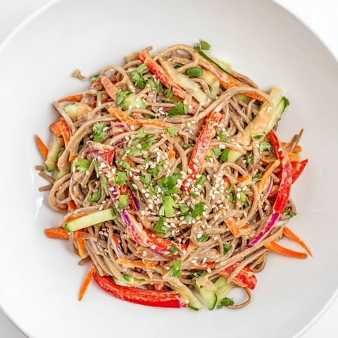 Cold and refreshing soba noodle salad tossed with colorful veggies and creamy peanut dressing.