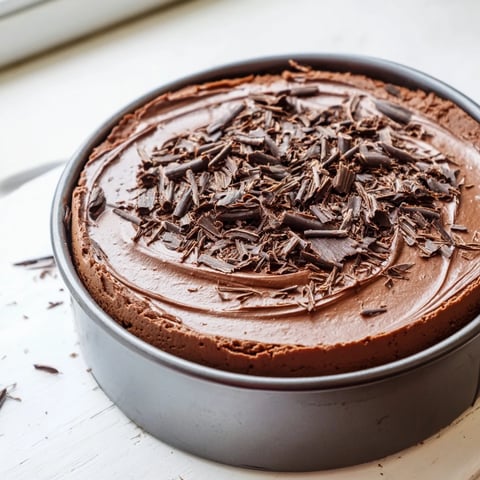 Rich chocolate cottage cheese cheesecake with a graham cracker crust, ready to serve.