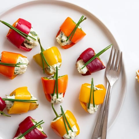 Cheerful close-up of festive Bell Pepper Christmas Bows, filled with creamy, fresh herb filling.