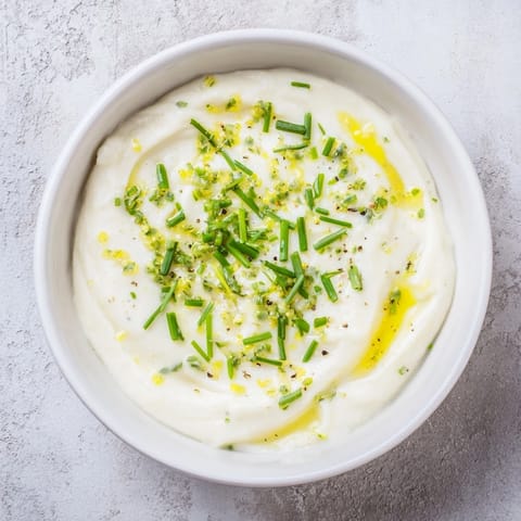 Zesty veggie ranch dip with a creamy texture, perfect alongside colorful vegetable sticks for dipping.