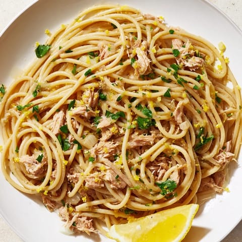 A close-up of Lemon-Garlic Tuna Spaghetti: a quick and easy Italian pasta meal, ready to eat.