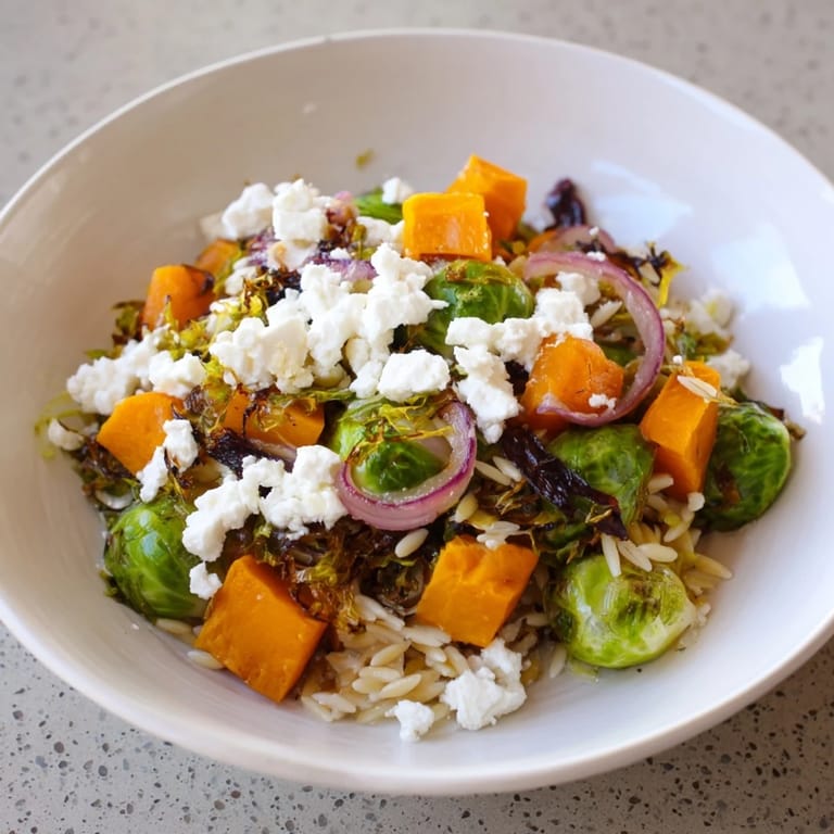 A beautiful close-up of the Best Fall Harvest Orzo Salad, showcasing vibrant vegetables and a light dressing.