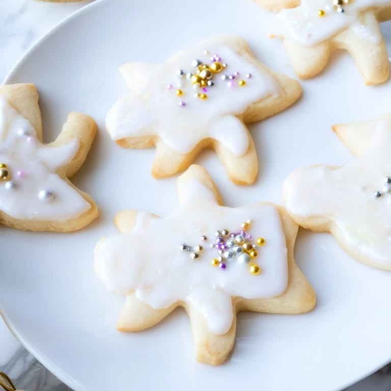 Close-up of freshly baked Biscuits Anges de Noël, delicate, buttery and perfect for Christmas gifting.