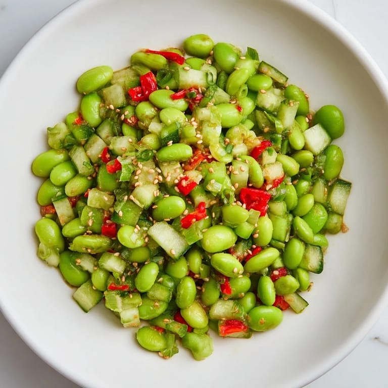 Easy Asian-inspired edamame salad recipe, featuring chopped vegetables and a flavorful dressing.