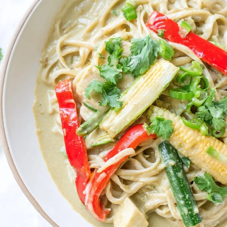 A bowl of aromatic Thai Curry Pasta, brimming with tender pasta and vibrant, crisp vegetables.