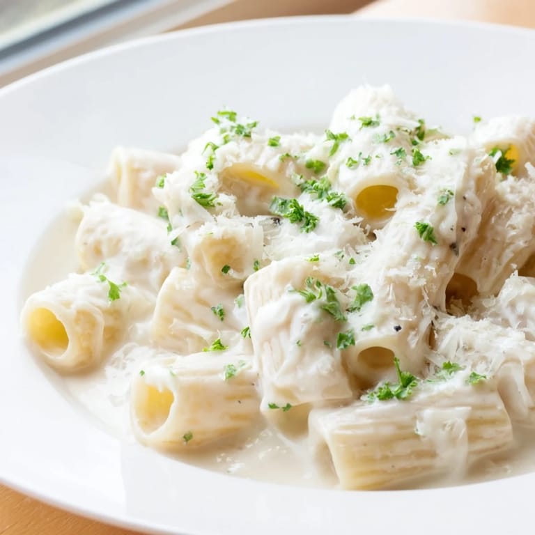 Fresh parsley and grated Parmesan top this easy Creamy Milk Pasta One-Pot for a comforting meal.