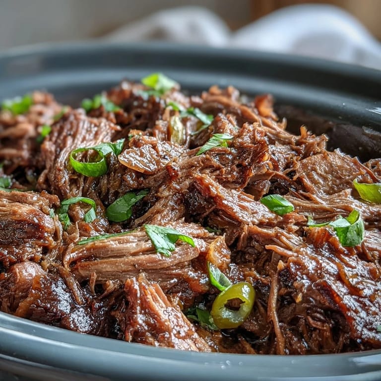 Savory Slow Cooker Mississippi-Style Ranch Beef served over fluffy mashed potatoes, ready for an easy family dinner.