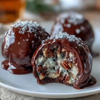 Classic Southern Kentucky Derby Bourbon Balls with rich chocolate coating and crunchy pecans, perfect for festive gatherings.